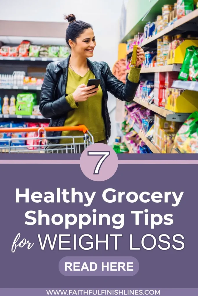 A woman holding a phone in a grocery store checking her grocery list with a text overlay that reads as 7 Healthy Grocery Shopping Tips for Weight Loss.
